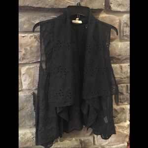 A black see through vest